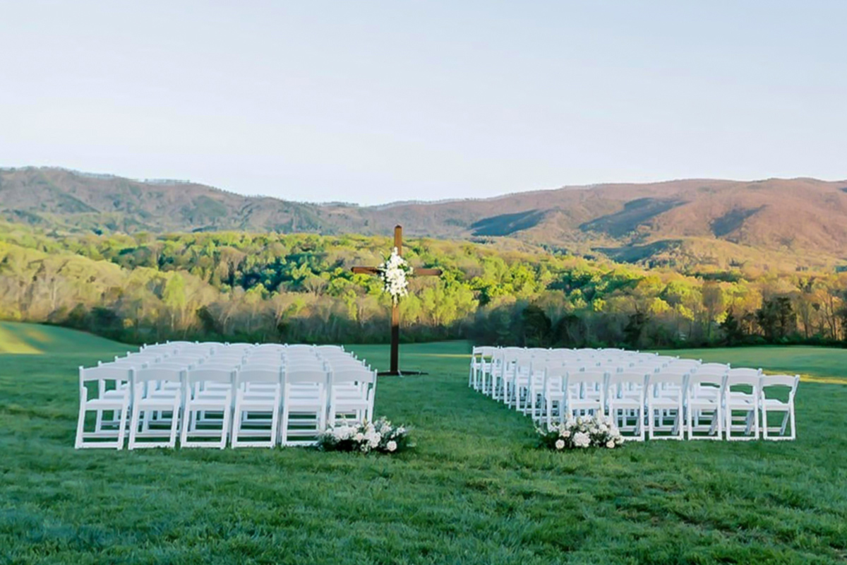Ceremony chairs on the grass, the blue ridges beyond
