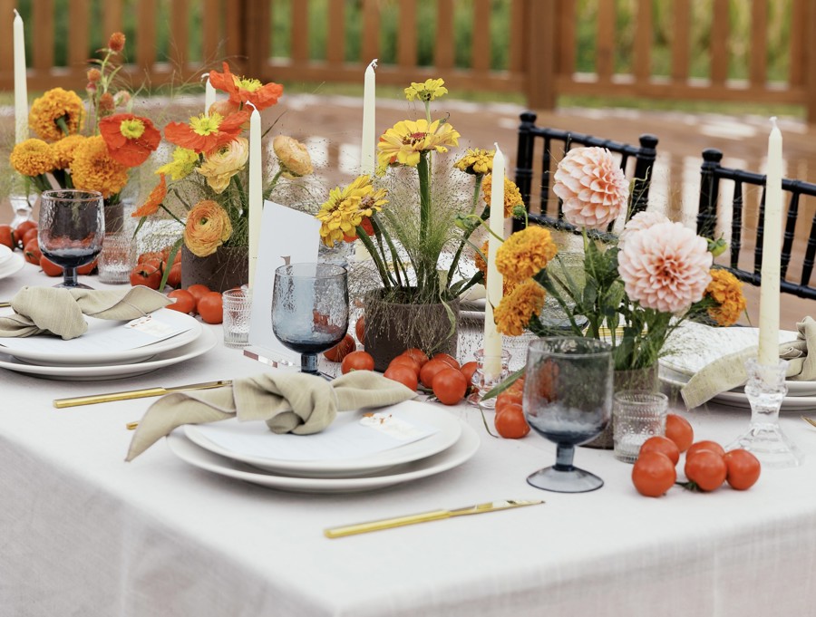 A place setting, candles and autumn flowers